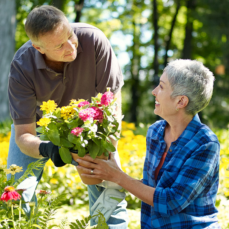 man and woman outside with flowers
